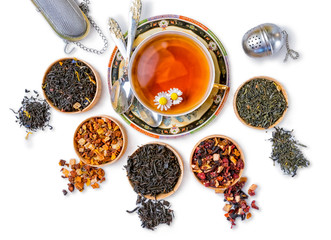 different types of tea on a white background. a kind of delicious tea, fruit tea. top view. place...