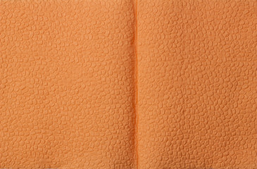 Fototapeta premium Background of an orange napkin in the form of an open book