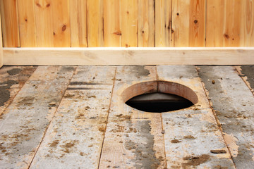 Background of a wooden street toilet , closeup