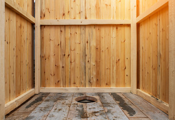 Background of a wooden street toilet