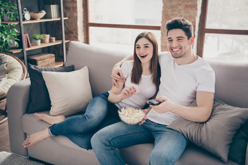 Portrait of her she his he nice attractive cheerful cheery glad friends friendship sitting on divan...