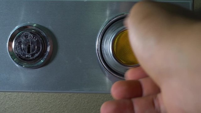 Man hand Opening old safe combination lock turning dials.