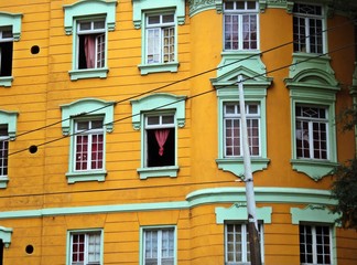 Green windows and the yellow background in the center of the city, Sé square.