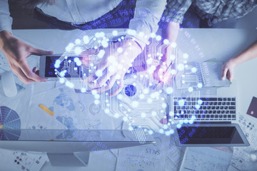 Double exposure of man and woman working together and human brain hologram drawing. Brainstorm...