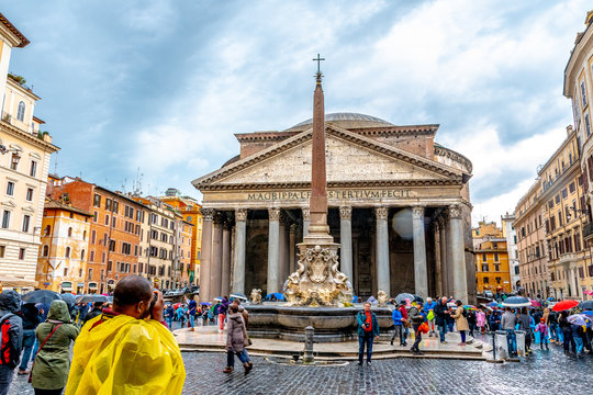 Italy, Rome. The Pantheon a Catholic Church former Roman temple in Piazza Della Rotonda. Cylindrical building with granite Corinthian columns. Fontana del Pantheon obelisk in front.