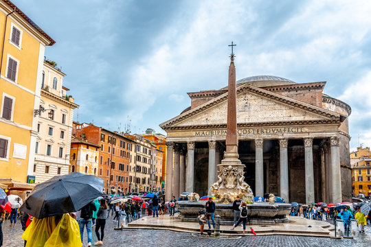 Italy, Rome. The Pantheon a Catholic Church former Roman temple in Piazza Della Rotonda. Cylindrical building with granite Corinthian columns. Fontana del Pantheon obelisk in front.