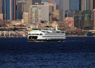 Ferry In Front Of The Waterfront Skyline Of Seattle