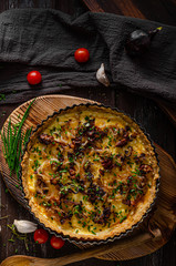 Homemade cheese quiche with onion and bacon