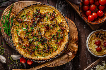 Homemade cheese quiche with onion and bacon