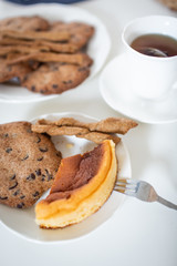 Healthy and delicious gluten free cakes and cheesecake served with tea in a cup