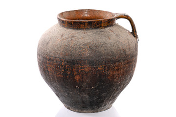 Old handmade clay pitcher isolated on a white background.