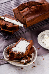 Banana bread with cocoa, slices with cottage cheese, delicious breakfast, selective focus, vertical format.