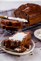 Banana bread with cocoa, slices with cottage cheese, delicious breakfast, selective focus, vertical format.