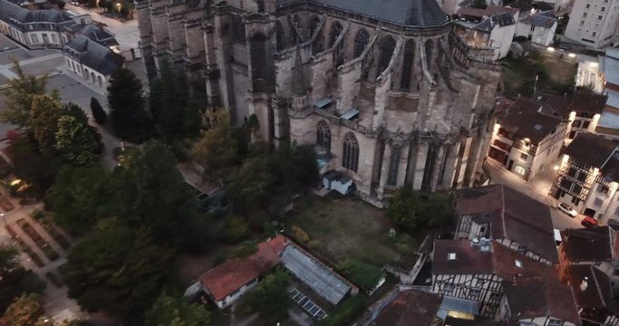 Historical aerial view of Limoges Cathedral illuminated at dusk, France 