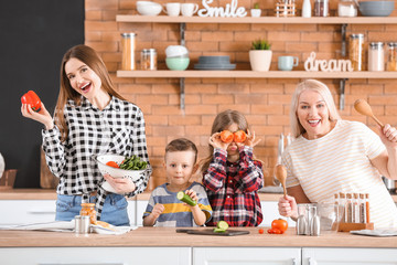 Big family cooking together in kitchen