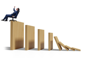 Businessman in domino effect concept