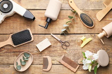 Rolgordijnen Set of hairdresser's accessories on wooden background © Pixel-Shot