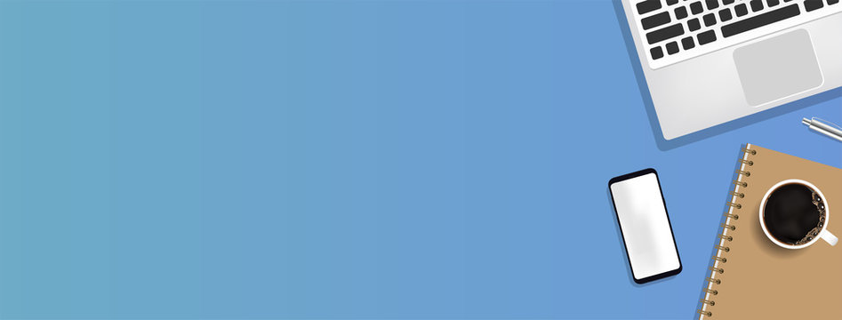 Minimal work space - Creative flat lay photo of workspace desk. Top view office desk with laptop, notebooks and coffee cup on blue color background. Panoramic banner background with copy space.