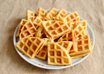 freshly baked waffles on a plate.