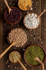 bowl with beans and legumes on old wooden
