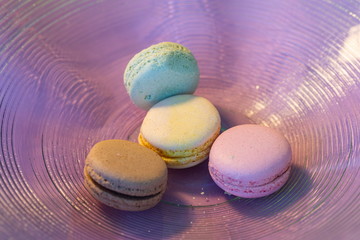 Macarons in different colours on a background