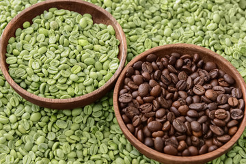 Plates with roasted and green coffee beans