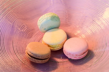 Macarons in different colours on a background