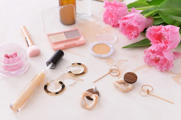 Obraz na płótnie Canvas Makeup cosmetics with jewelry on white background