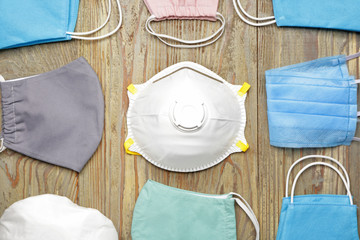 Medical masks on wooden background