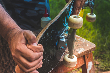 man cleaning an old skate -  macro