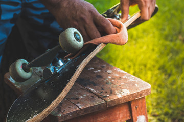 man cleaning an old skate - closeup