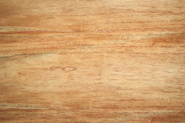 Plywood texture background. Top view of vintage wooden table. Wood texture in natural light yellow...