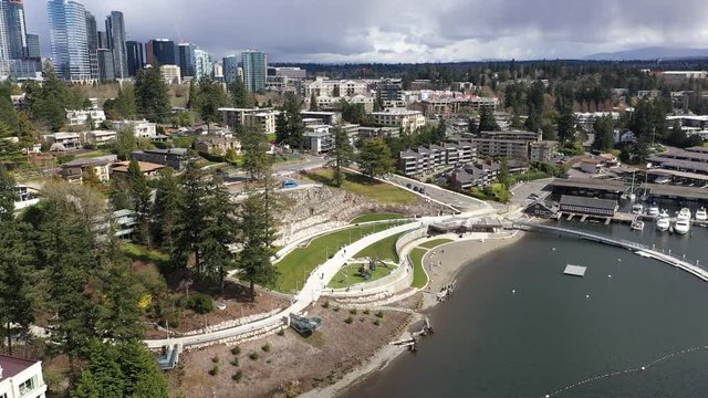Aerial / drone footage of Meydenbauer Bay Park, beach park, marinas with waterfront mansions in Belleview near Seattle, Washington during the COVID-19 pandemic