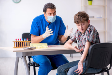 Young boy visiting doctor in hospital