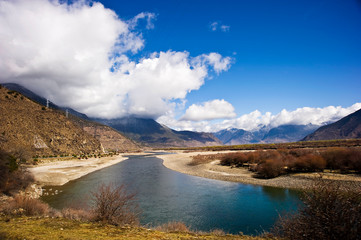 mountain and river landscape with blue sky and clouds, Tibet, China 