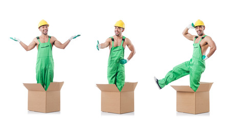 Man in coveralls with boxes