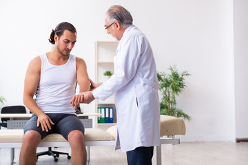 Fototapeta premium Young male patient visiting experienced doctor