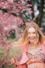 Girl in a cherry blossom garden
