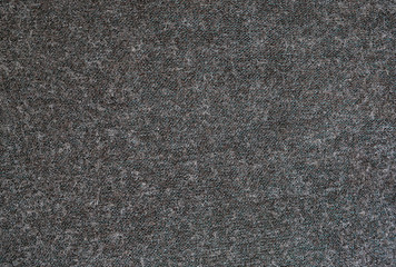 Close-up Surface of dark grey felted fabric texture background.