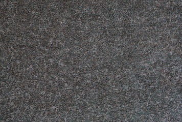 Close-up Surface of dark grey felted fabric texture background.