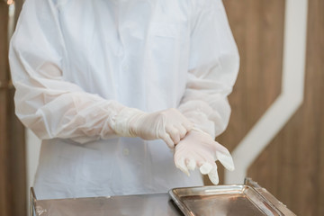 Medical staff prepare wearing Personal Protective Equipment (PPE) for protect coronavirus covid-19...