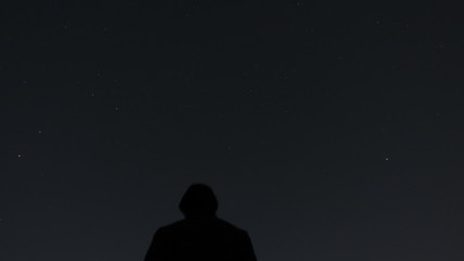 Fototapeta na wymiar silhouette of a man walking in the night