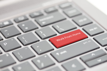 Work from home concept shown on close up enter key on notebook keyboard