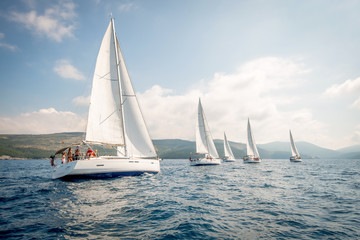 yachts during a sailing regatta at sea - obrazy, fototapety, plakaty