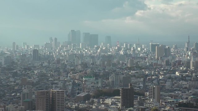 NAGOYA, AICHI, JAPAN - FEB 2020 : Aerial high angle view of cityscape of Nagoya city. View of buildings and street traffic around central downtown area. Time lapse shot in day time.