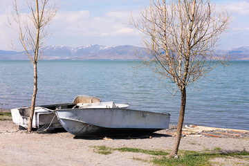 Two boats on shore of Lake Sevan in spring. Armenia