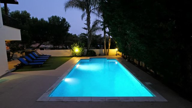 The night view of the villa swimming pool. Pissouri village. Limassol district. Cyprus