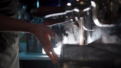 barista make hot black espresso in coffee machine - Powered by Adobe