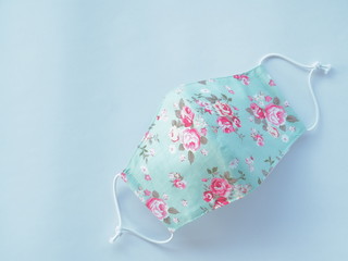 Fabric mask with sweet flower pattern. Used to prevent dust and viruses covid19 in the air
