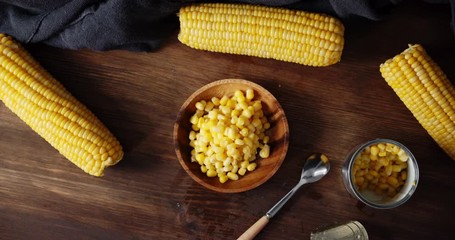 Corn in a tin and the bowl rotate slowly. - Powered by Adobe